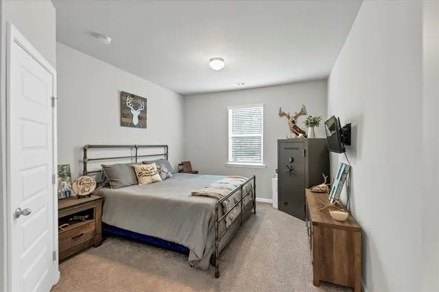 a bedroom with a bed and furniture