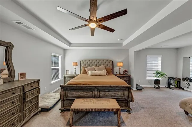 a bed room with a bed and a window