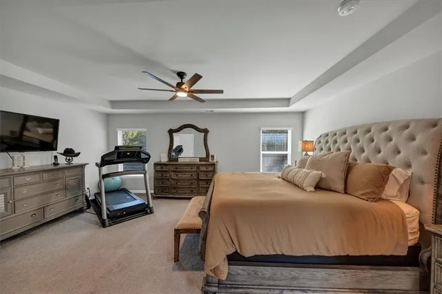 a room with a bed and a flat screen tv