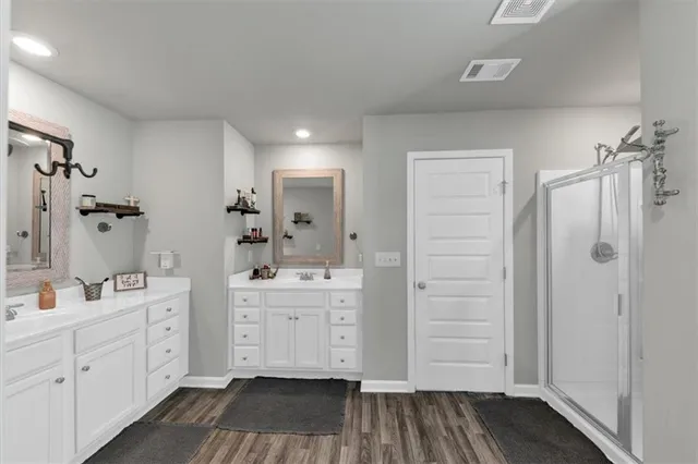 a view of a patio with a table chairs and a potted plant