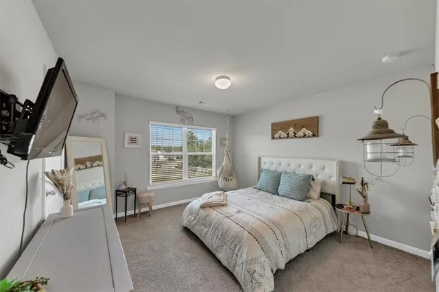 a front view of a house with sitting area