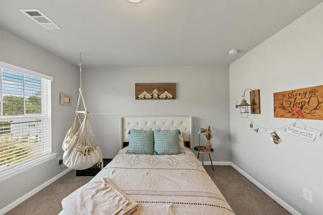 a view of a house with wooden walls and floor to ceiling window