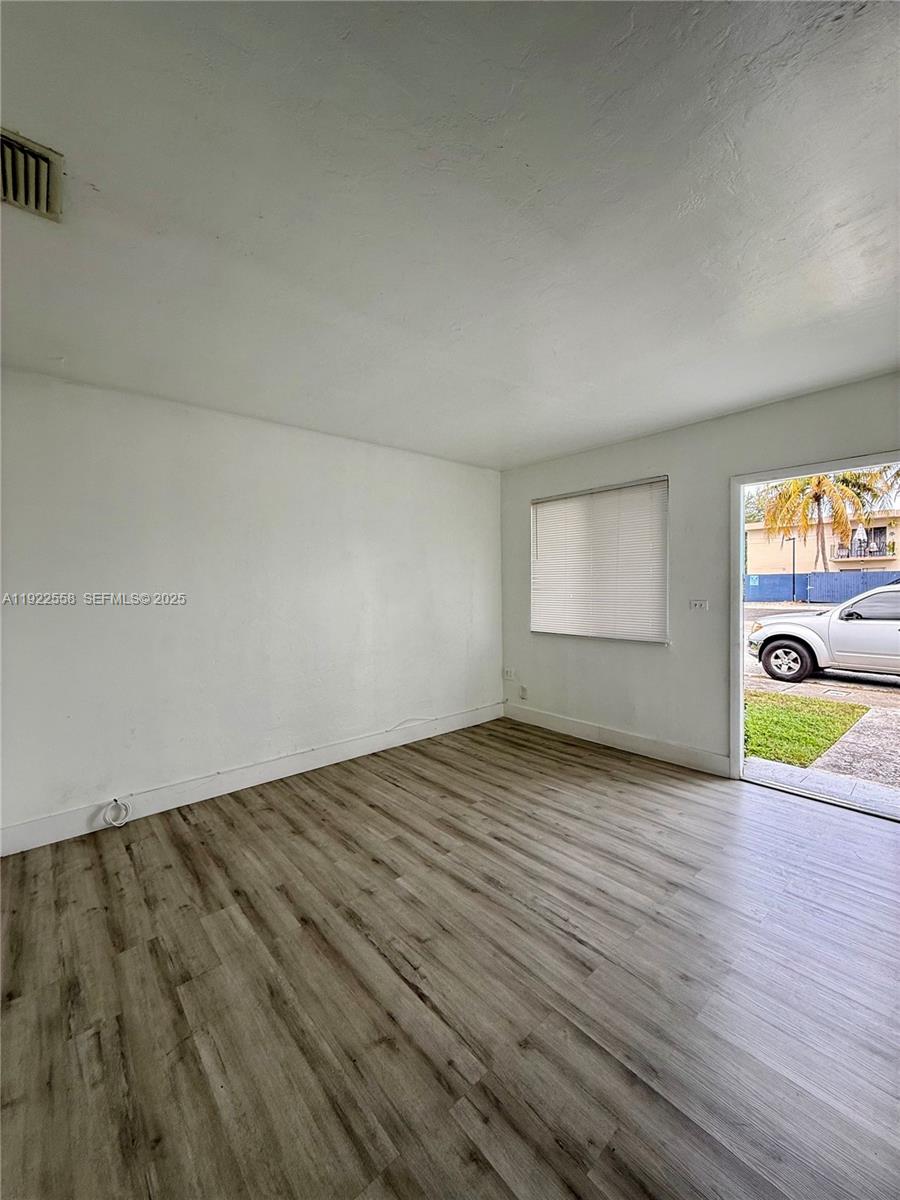 5700 Southwest 4th Street, Unit 2 Miami, FL 33144 - Photo 3 of 9 a view of an empty room and window