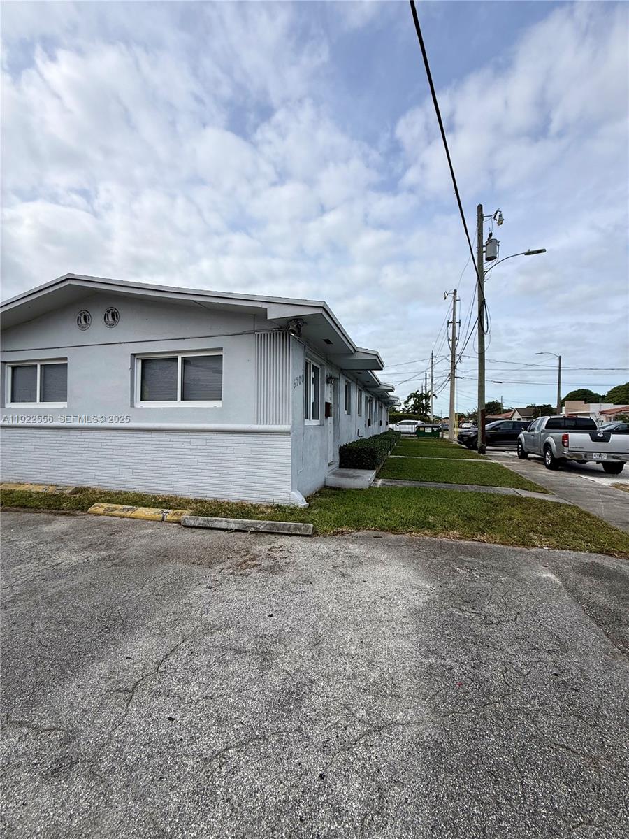 5700 Southwest 4th Street, Unit 2 Miami, FL 33144 - Photo 9 of 9 a view of a house with a yard