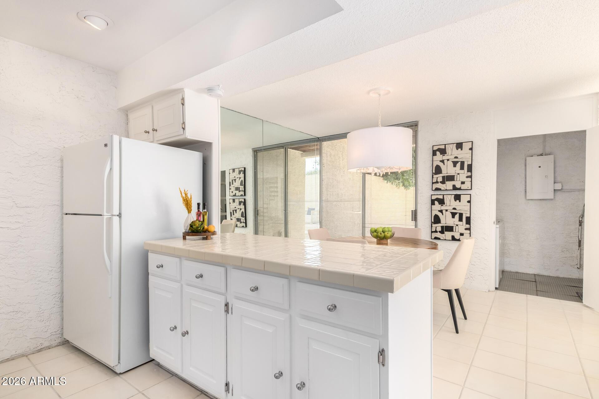 4656 North 40th Street Phoenix, AZ 85018 - Photo 13 of 28 a kitchen with white cabinets and refrigerator