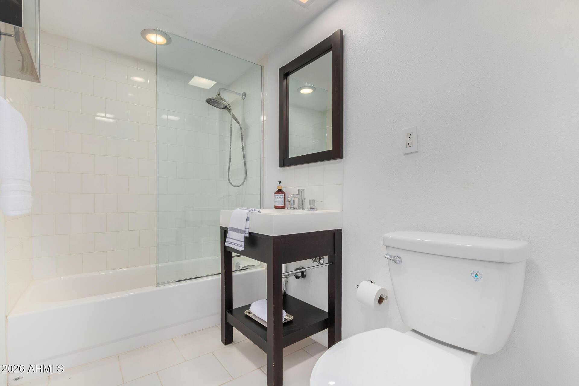 4656 North 40th Street Phoenix, AZ 85018 - Photo 16 of 28 a bathroom with a sink toilet a mirror and shower