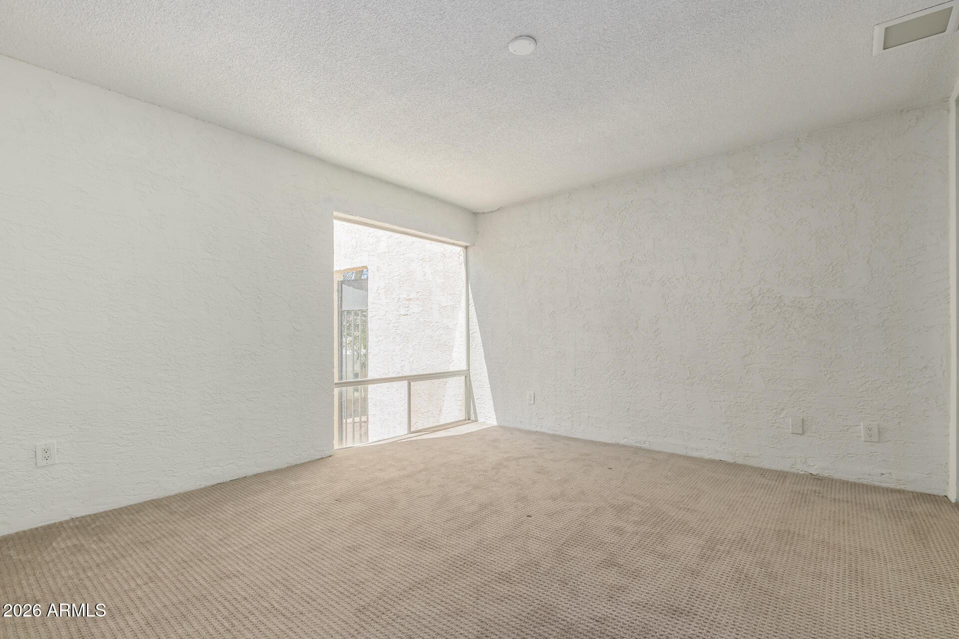 4656 North 40th Street Phoenix, AZ 85018 - Photo 17 of 28 an empty room with a window