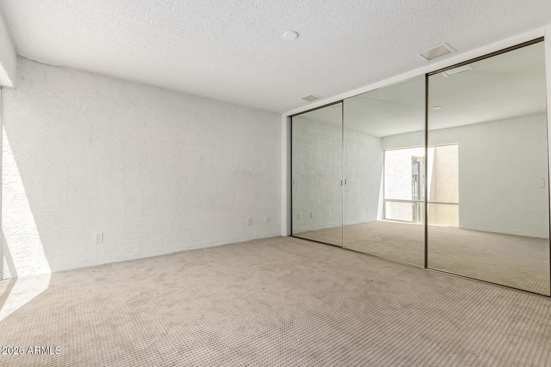 4656 North 40th Street Phoenix, AZ 85018 - Photo 18 of 28 a view of an empty room with a window