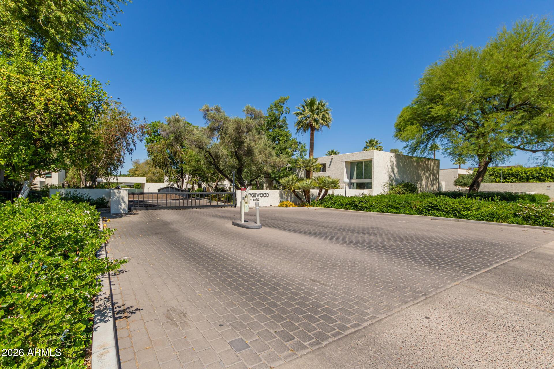 4656 North 40th Street Phoenix, AZ 85018 - Photo 3 of 28 a front view of a house with a yard and a garage