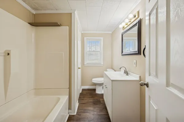 a bathroom with a sink a toilet and a bathtub