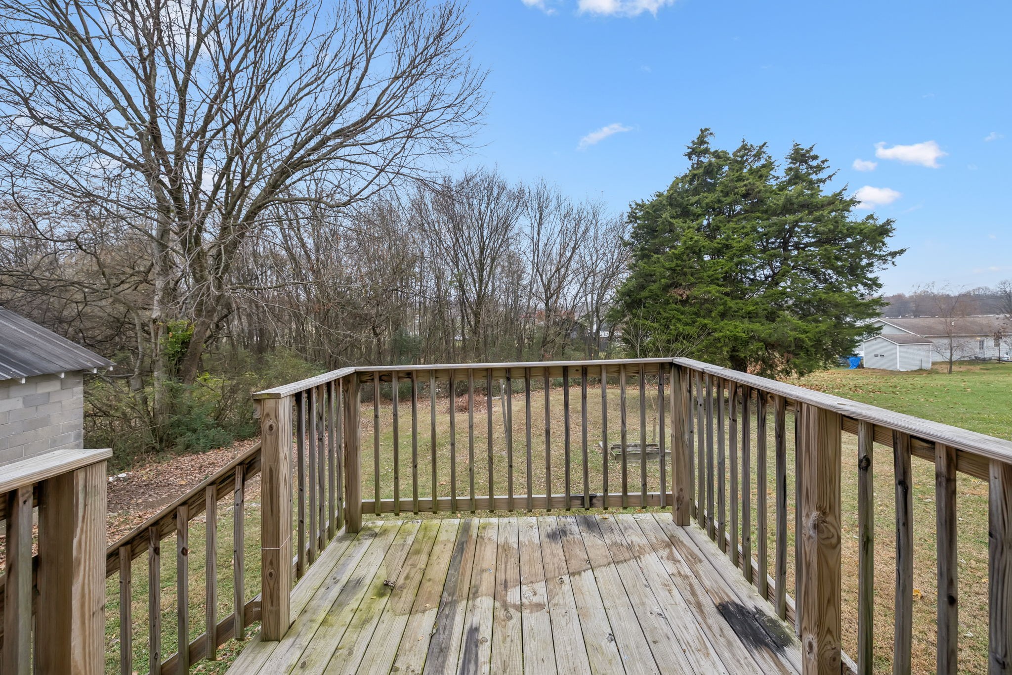 1323 Pleasant Grove Road Westmoreland, TN 37186 - Photo 23 of 26 a balcony with wooden floor and fence