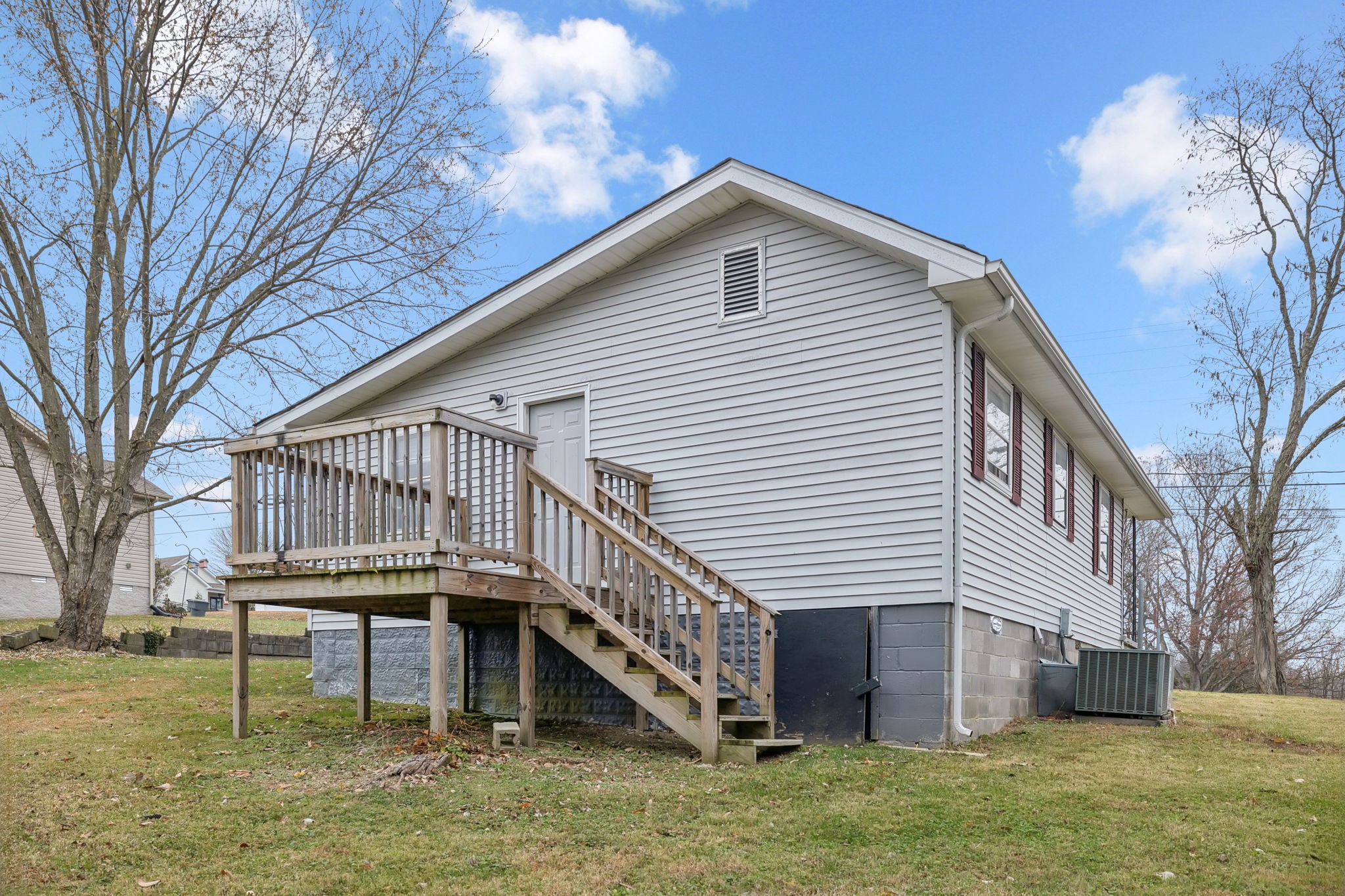 1323 Pleasant Grove Road Westmoreland, TN 37186 - Photo 24 of 26 a balcony with furniture and a yard