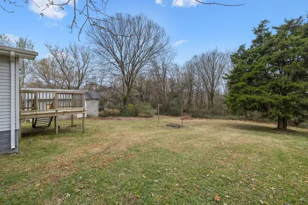 a view of a yard with a house