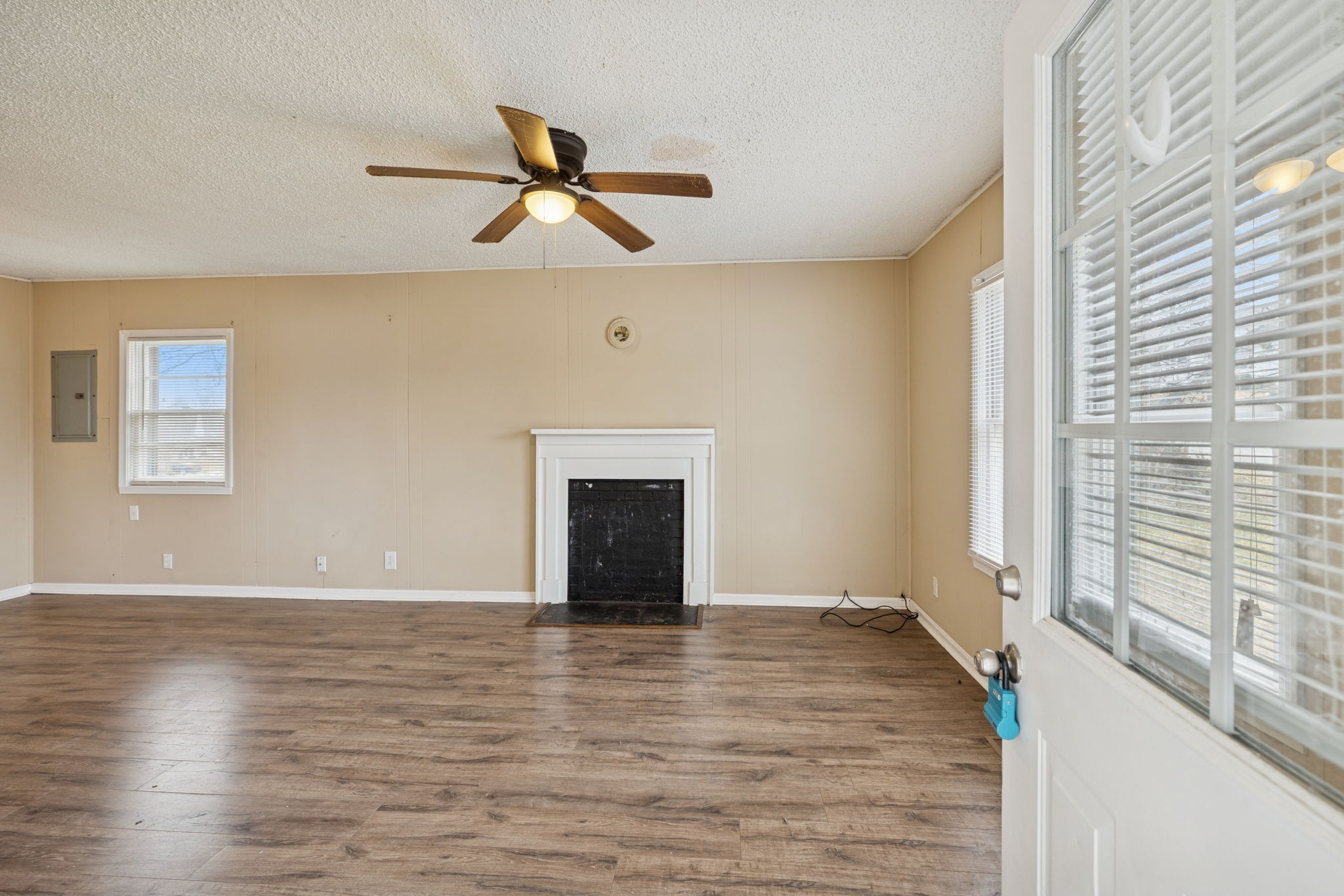 1323 Pleasant Grove Road Westmoreland, TN 37186 - Photo 4 of 26 a view of an empty room with wooden floor and a window