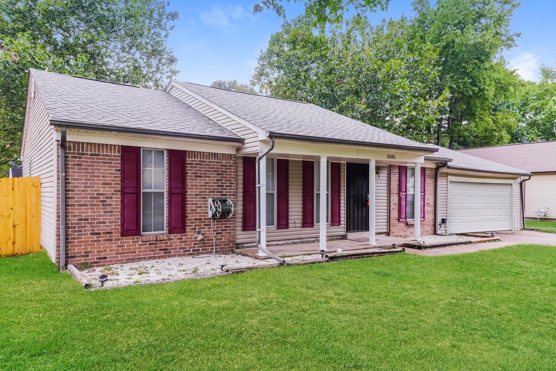 2145 Bobolink Trail Memphis, TN 38134 - Photo 2 of 16 a front view of a house with a yard and front view