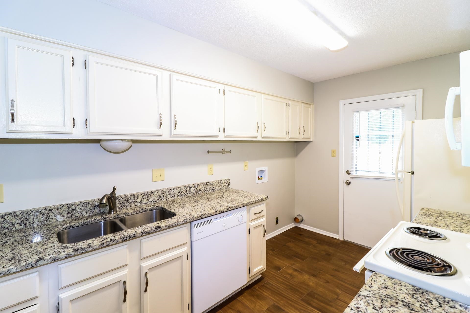 2145 Bobolink Trail Memphis, TN 38134 - Photo 6 of 16 a kitchen with granite countertop white cabinets and a sink