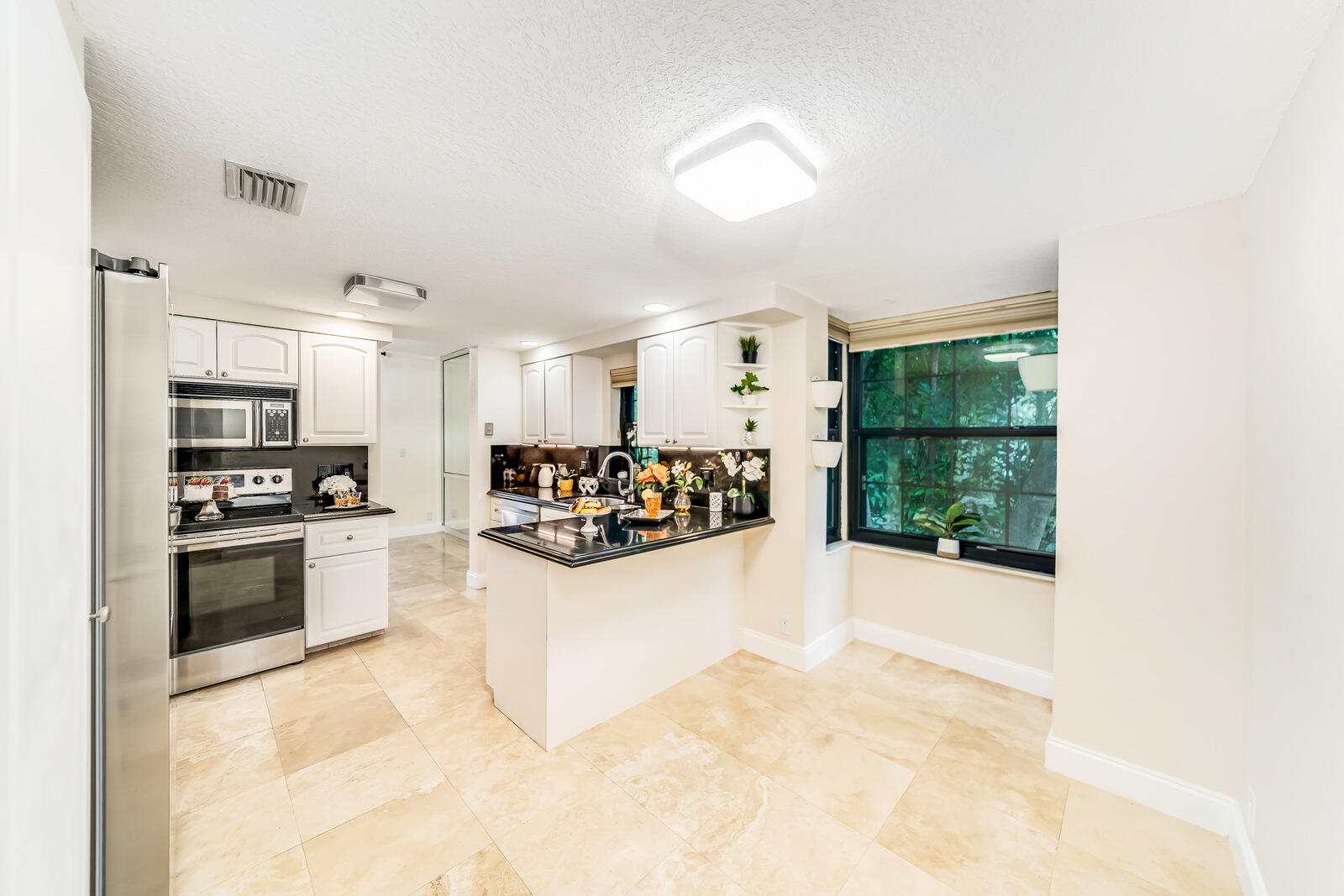 7715 La Mirada Drive Boca Raton, FL 33433 - Photo 17 of 78 eat in kitchen area