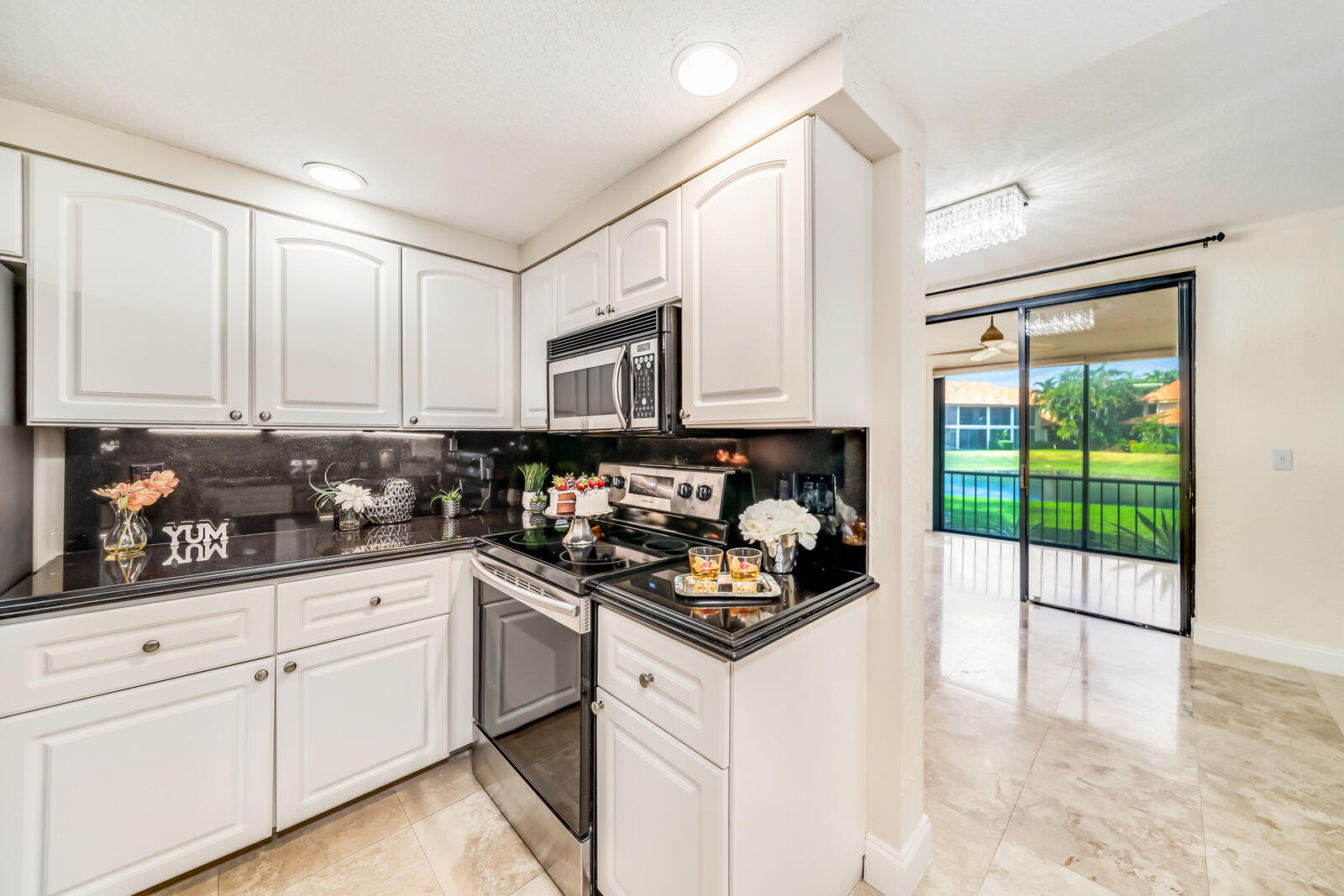 7715 La Mirada Drive Boca Raton, FL 33433 - Photo 25 of 78 heading to dining room