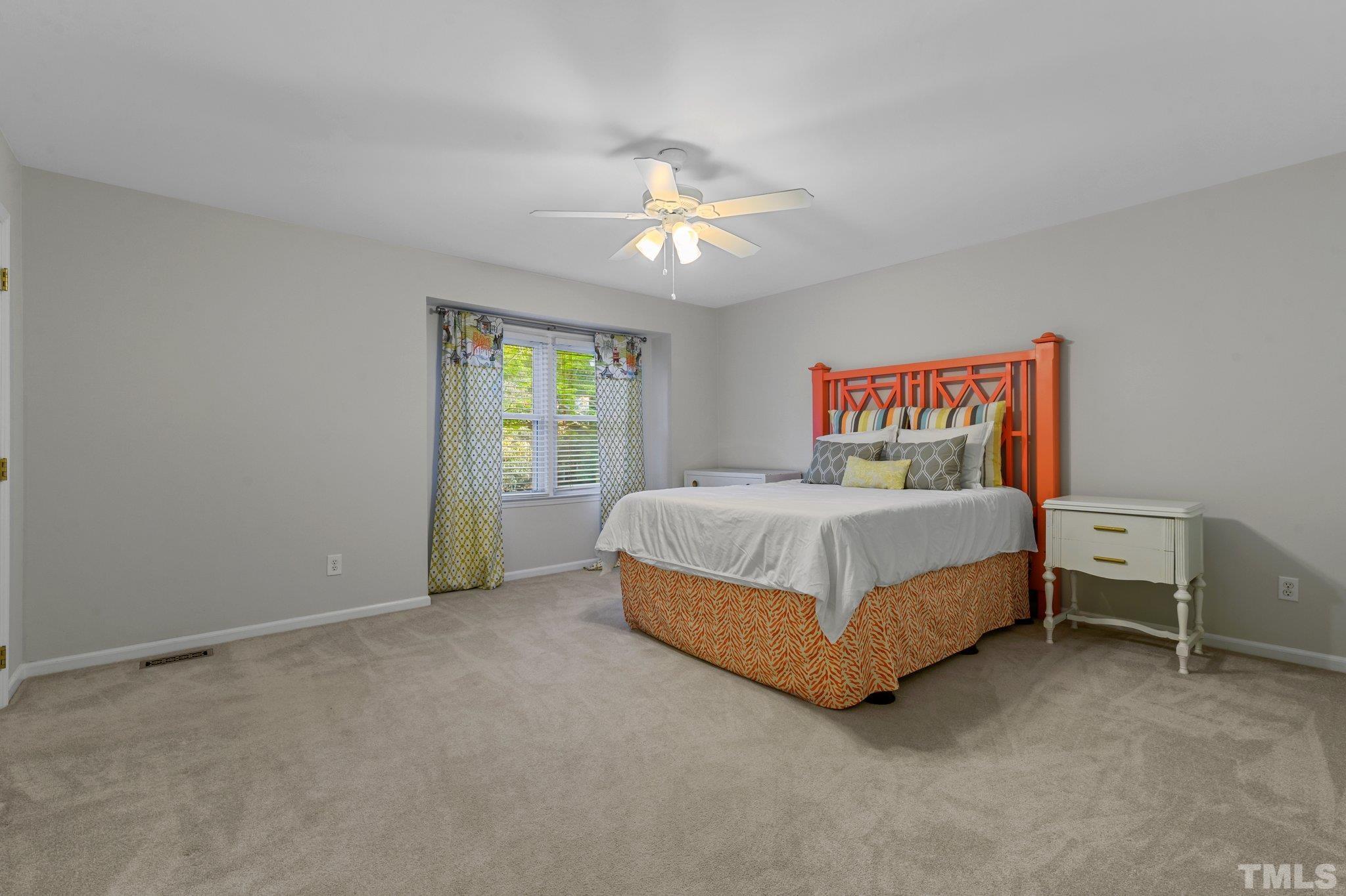 1502 Edgeside Court Raleigh, NC 27609 - Photo 11 of 27 Large Primary Bedroom with en suite full bathroom and walk-in closet.