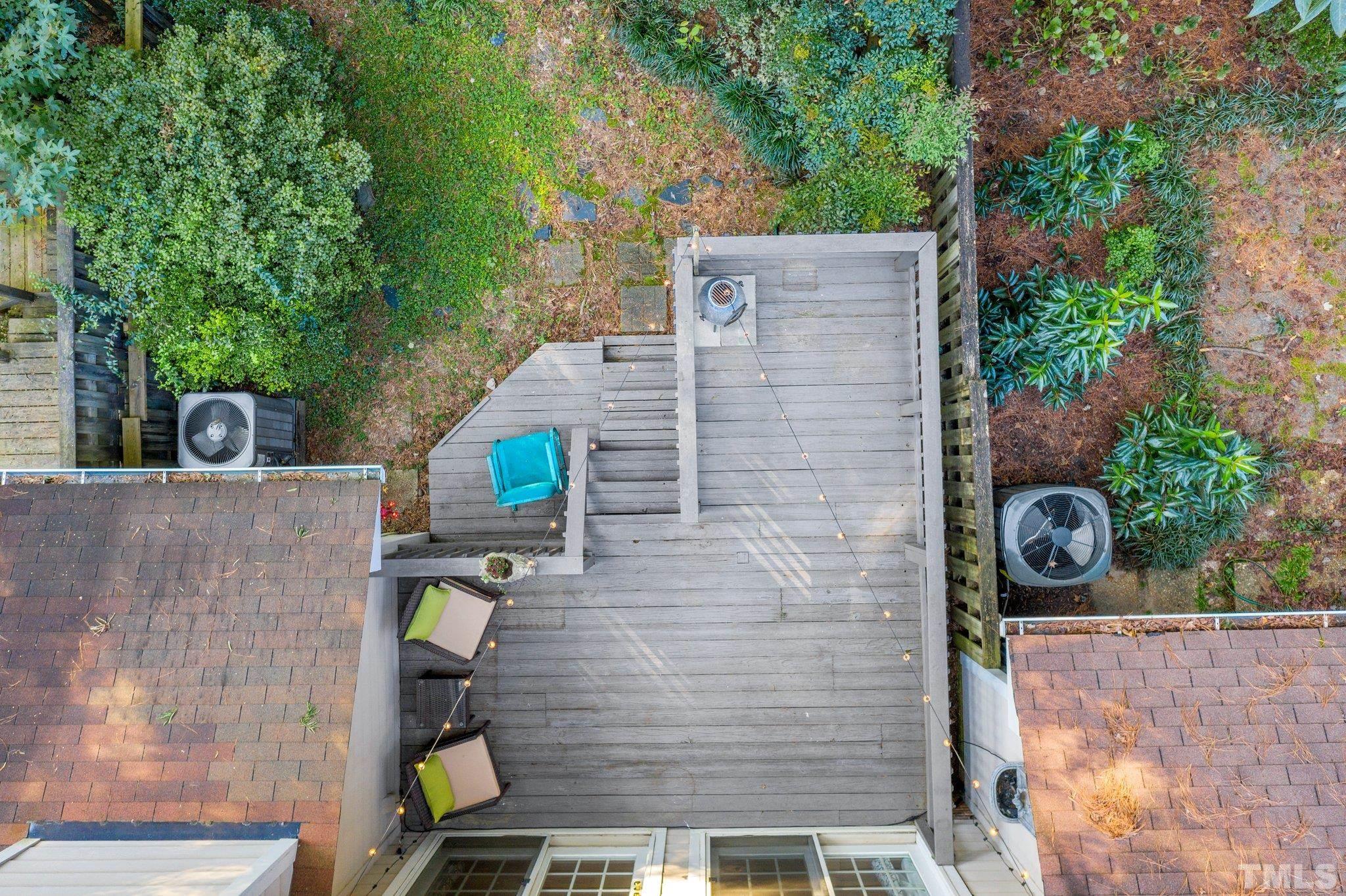 1502 Edgeside Court Raleigh, NC 27609 - Photo 22 of 27 Aerial view of the townhouse to see fenced in backyard backing to woods for more privacy.