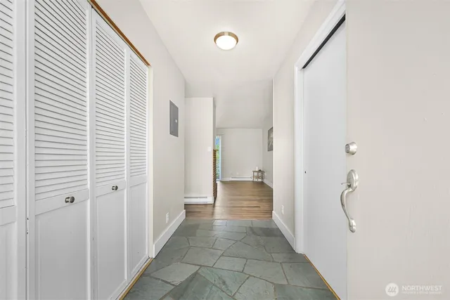 a view of a hallway with a white walls