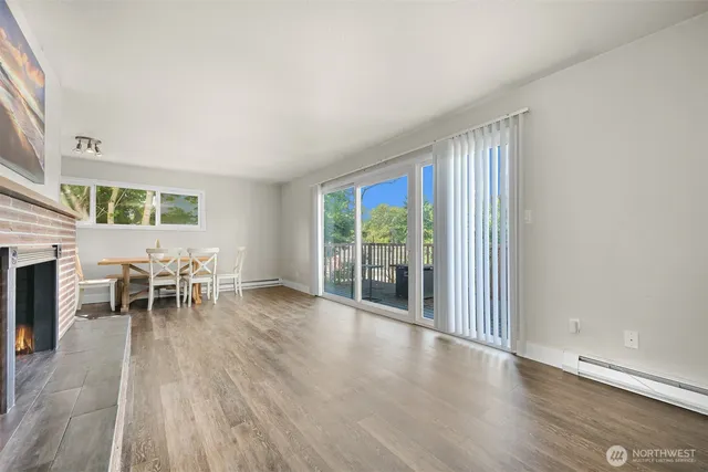 a view of a livingroom with furniture window and wooden floor