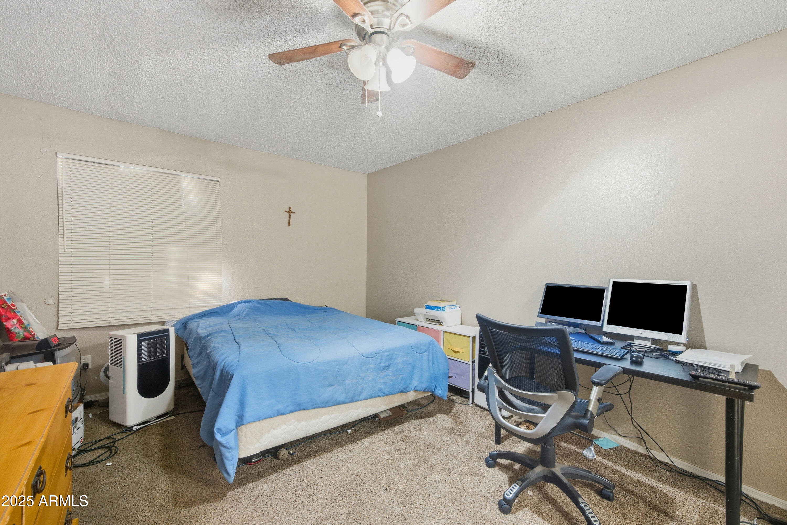 4242 North 69th Lane, Unit 1333 Phoenix, AZ 85033 - Photo 13 of 18 a bedroom with a workspace