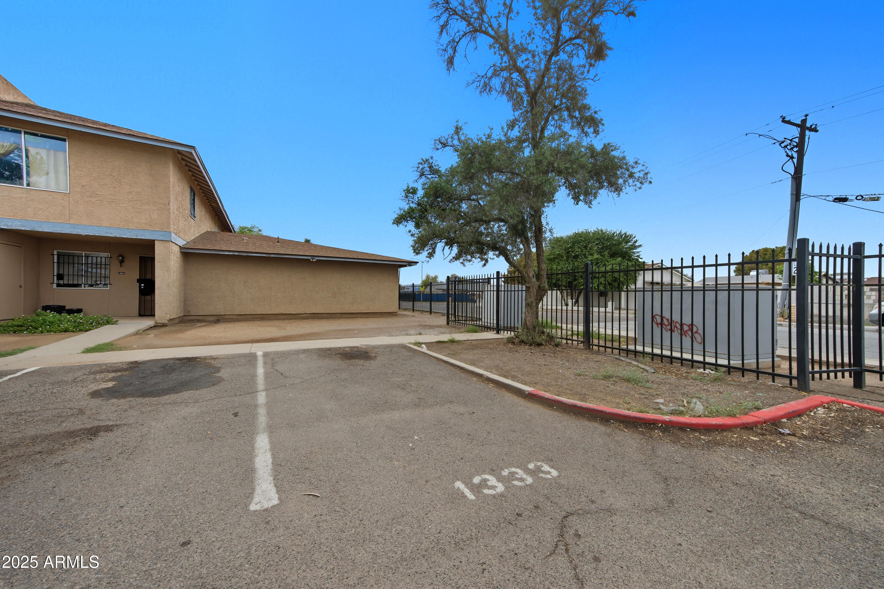 4242 North 69th Lane, Unit 1333 Phoenix, AZ 85033 - Photo 18 of 18 a backyard of a house
