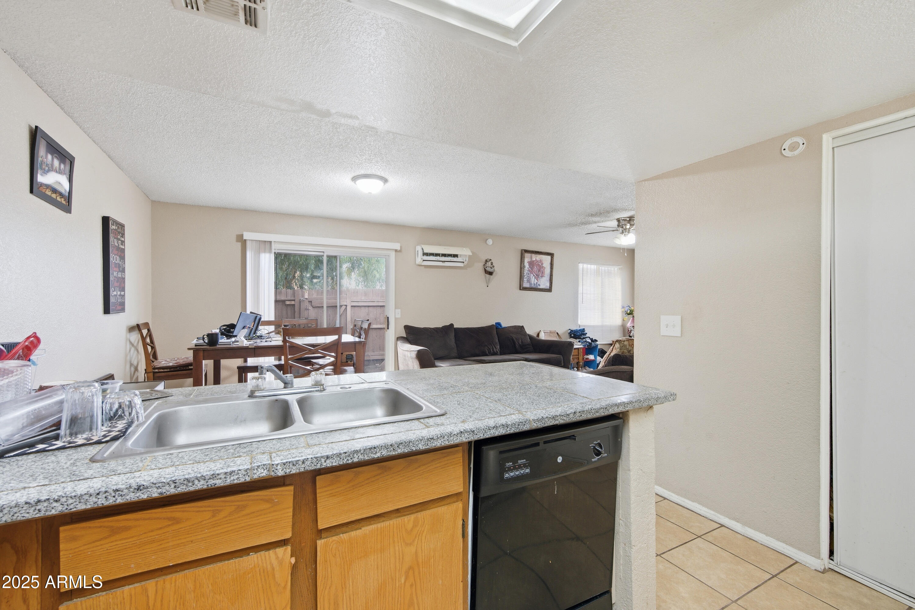 4242 North 69th Lane, Unit 1333 Phoenix, AZ 85033 - Photo 9 of 18 a view of a sink and cabinet with granite countertop furniture