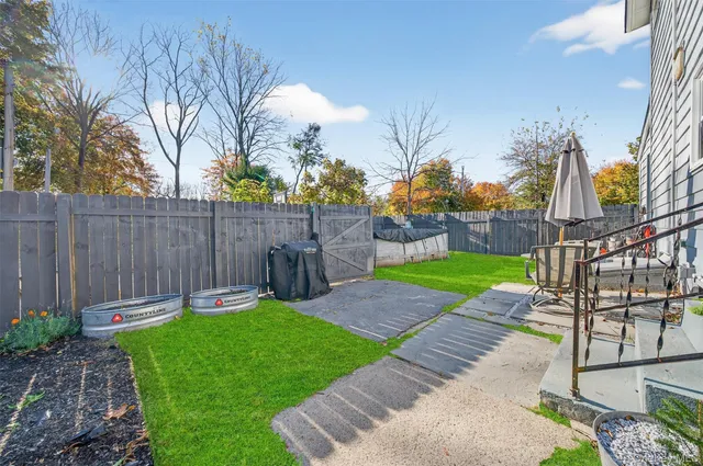 a kitchen with stainless steel appliances a stove refrigerator and cabinets