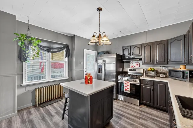 a bathroom with a sink vanity and mirror