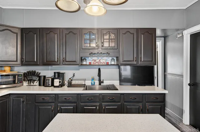 a view of closet with wooden floor