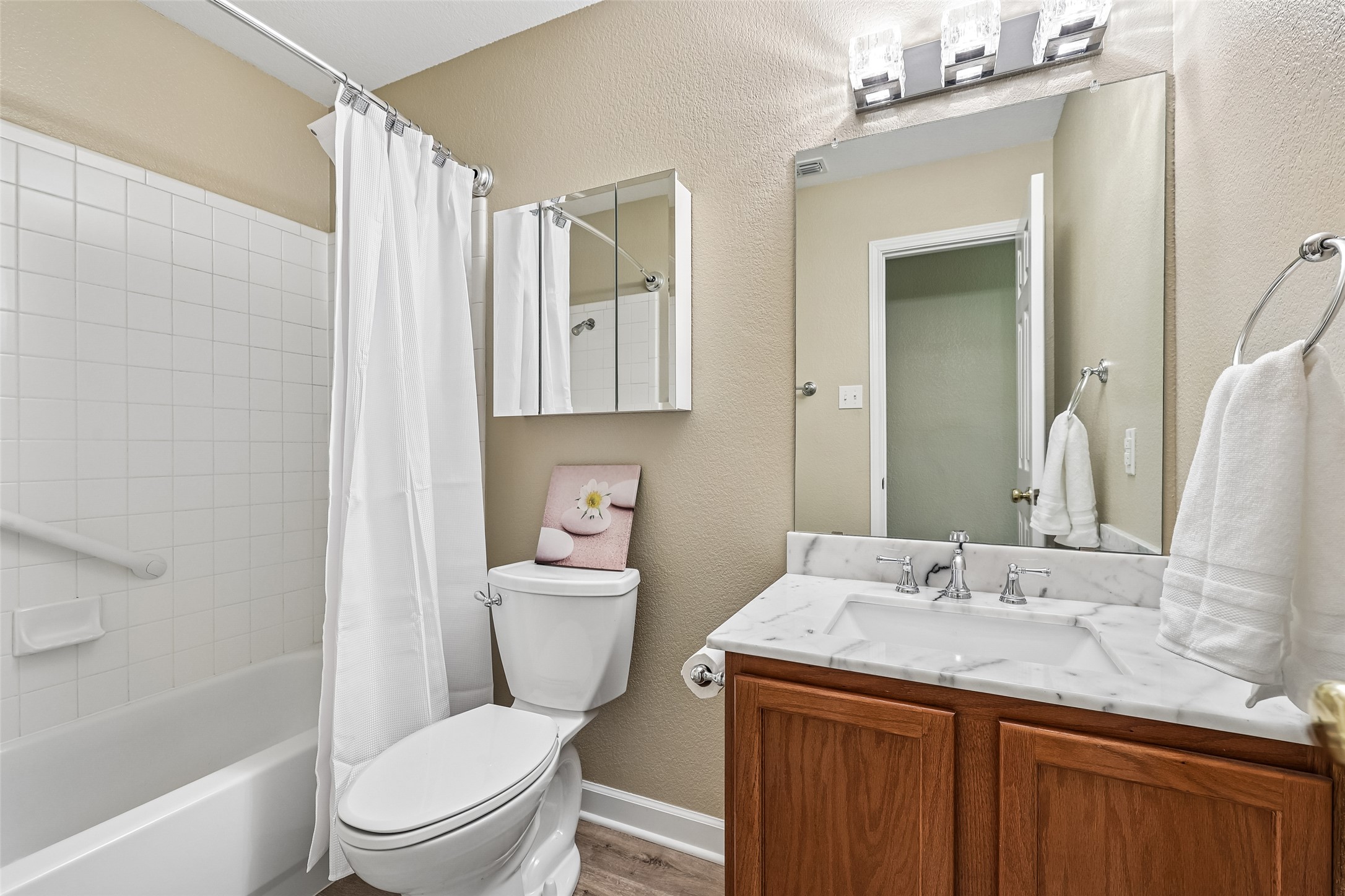 152 Grant Way Kyle, TX 78640 - Photo 33 of 39 a bathroom with a granite countertop toilet sink and mirror
