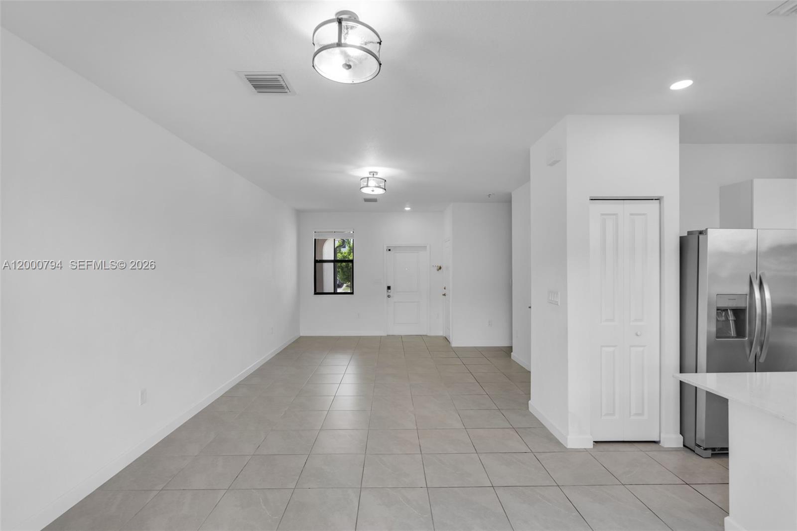 23077 Southwest 129th Place Miami, FL 33177 - Photo 14 of 43 a view of a kitchen with a sink and refrigerator
