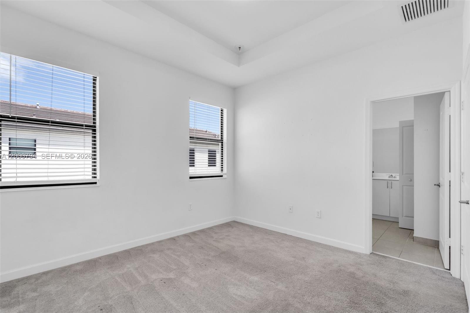 23077 Southwest 129th Place Miami, FL 33177 - Photo 23 of 43 a view of an empty room with a window