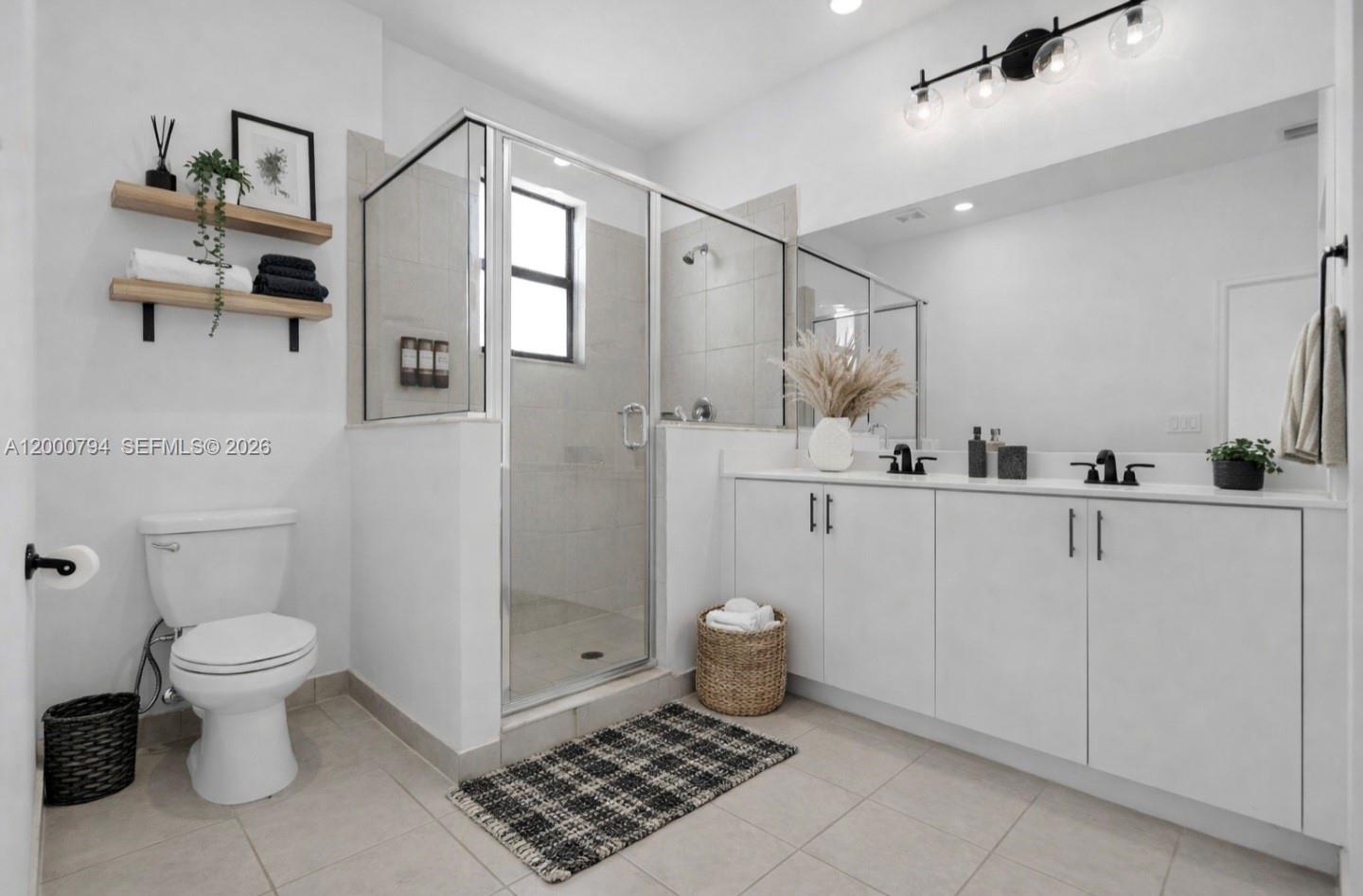 23077 Southwest 129th Place Miami, FL 33177 - Photo 26 of 43 a bathroom with a sink toilet and shower