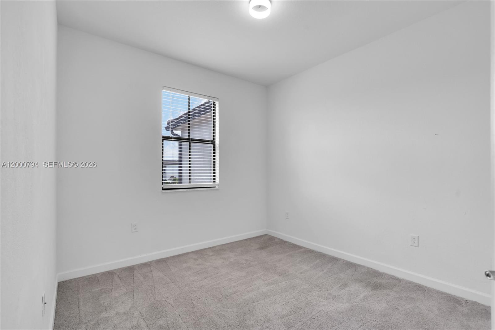 23077 Southwest 129th Place Miami, FL 33177 - Photo 31 of 43 an empty room with a window