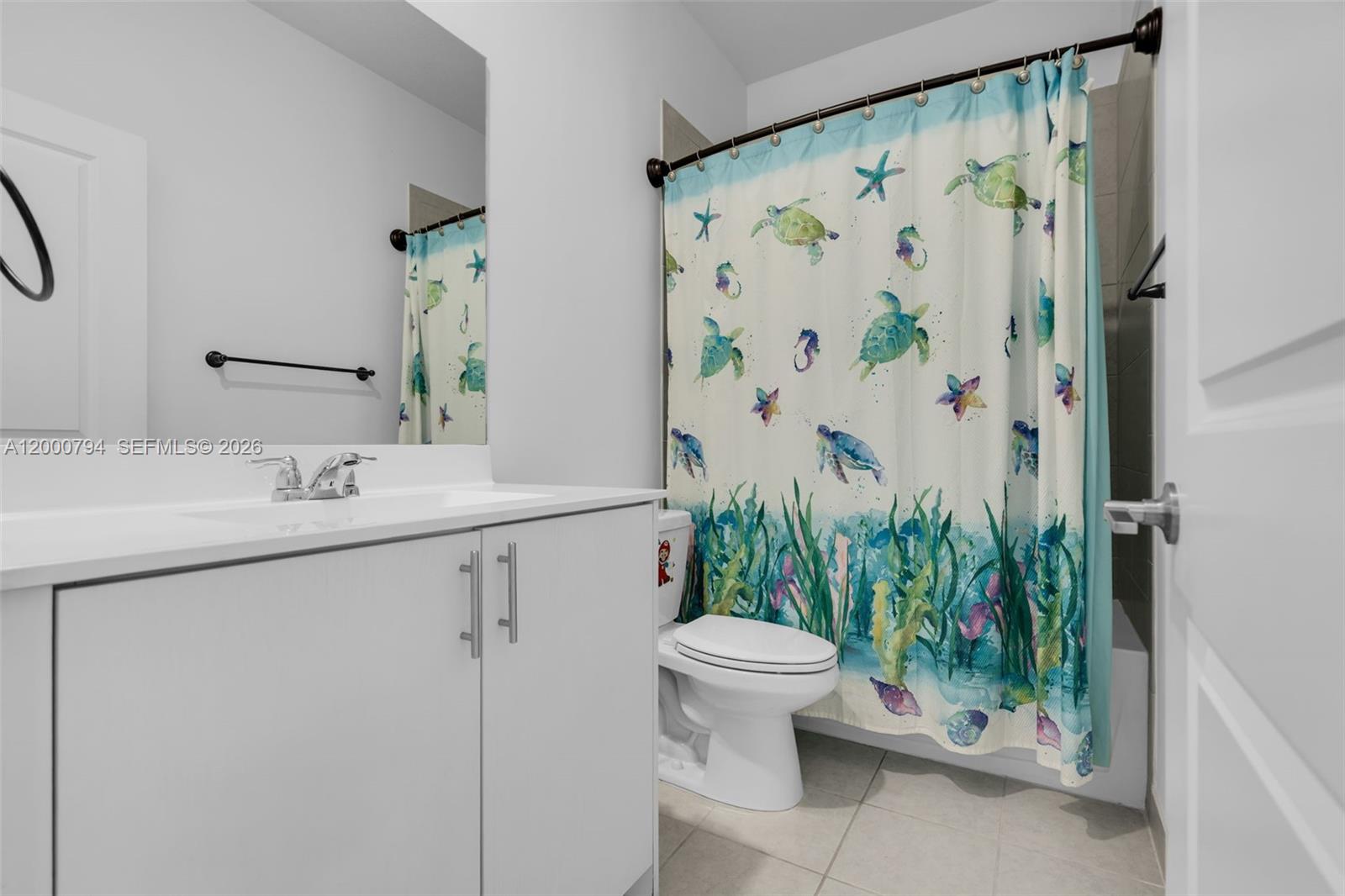 23077 Southwest 129th Place Miami, FL 33177 - Photo 33 of 43 a bathroom with a sink and mirror