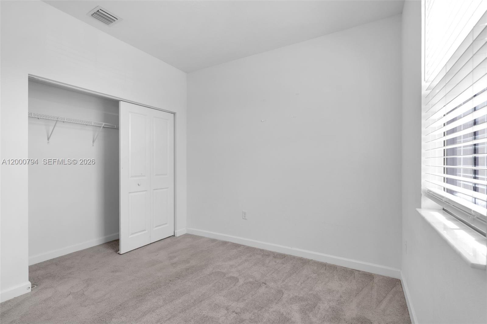 23077 Southwest 129th Place Miami, FL 33177 - Photo 34 of 43 an empty room with windows