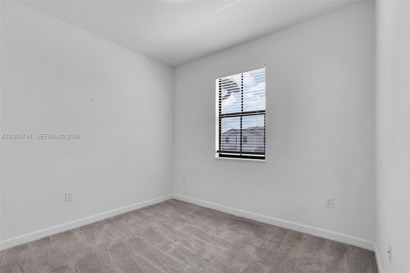 23077 Southwest 129th Place Miami, FL 33177 - Photo 35 of 43 an empty room with windows