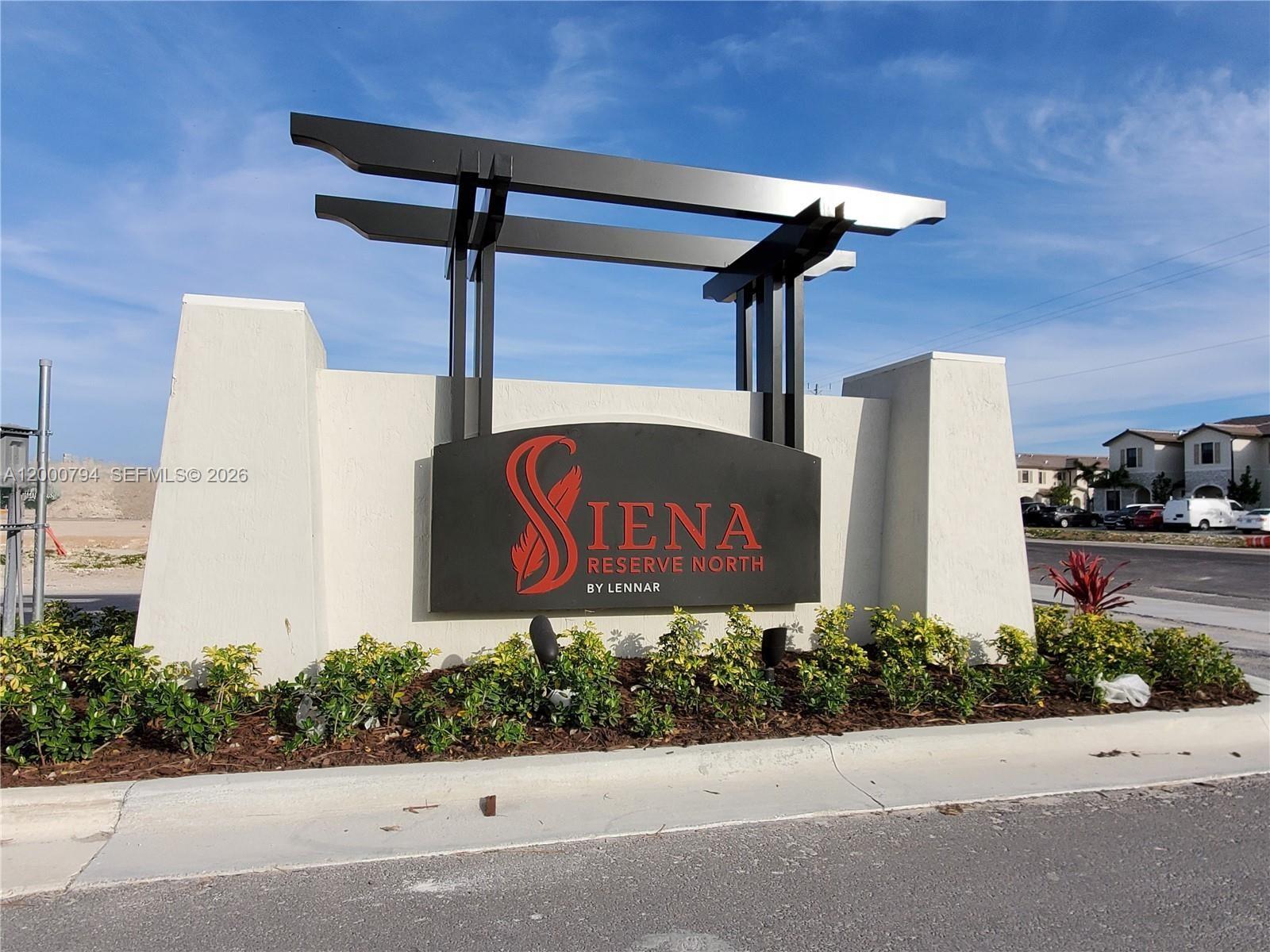 23077 Southwest 129th Place Miami, FL 33177 - Photo 38 of 43 a sign on the side of a building