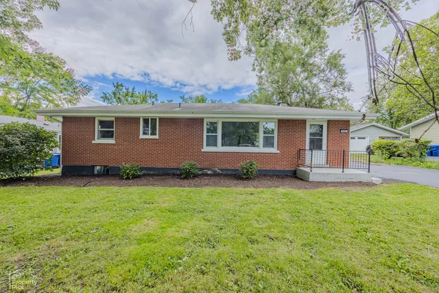 front view of house with a yard