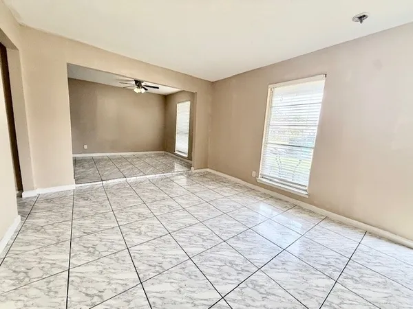 a view of an empty room and window