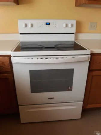 a kitchen with stainless steel appliances a stove a sink dishwasher and a microwave