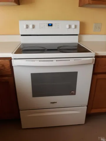 a kitchen with stainless steel appliances a stove a sink dishwasher and a microwave