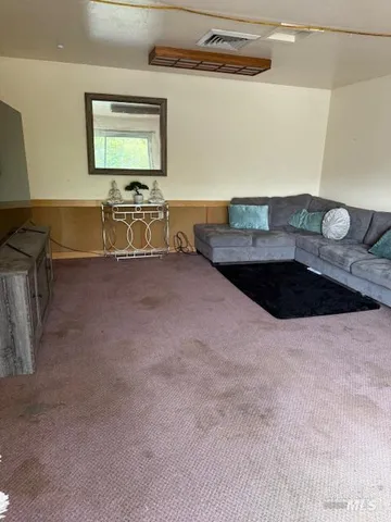 a kitchen with a sink a stove and cabinets