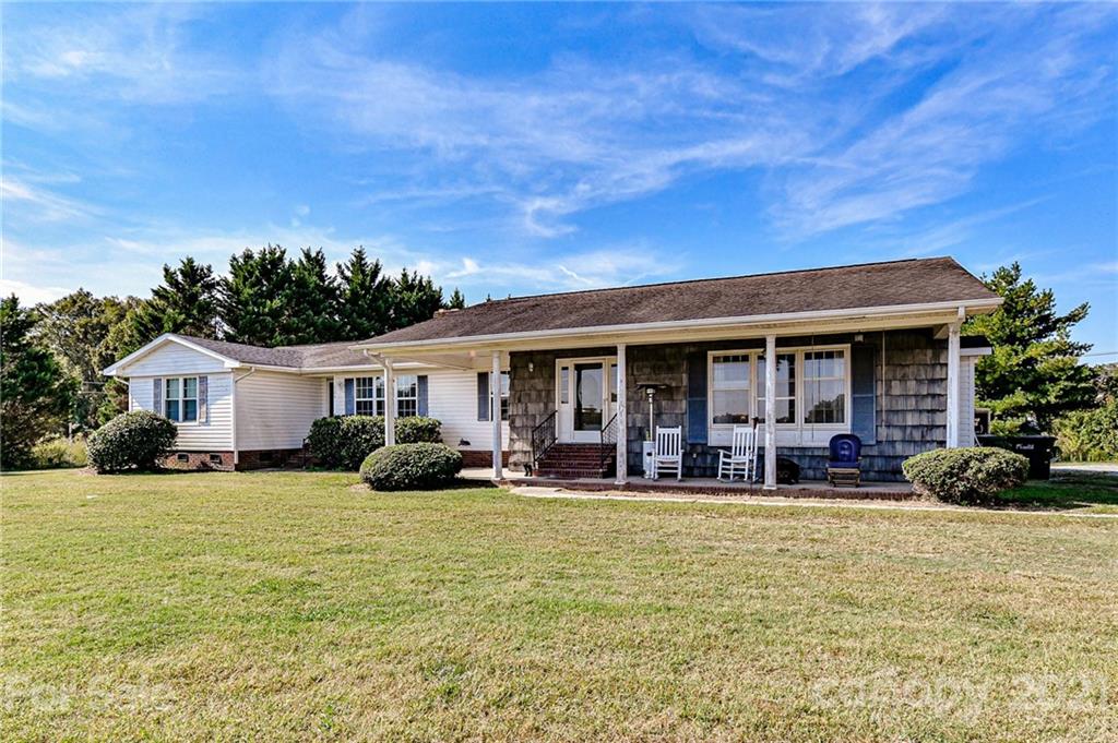 126 Baucom Deese Road Monroe, NC 28110 - Photo 2 of 28 a front view of a house with yard patio and fire pit