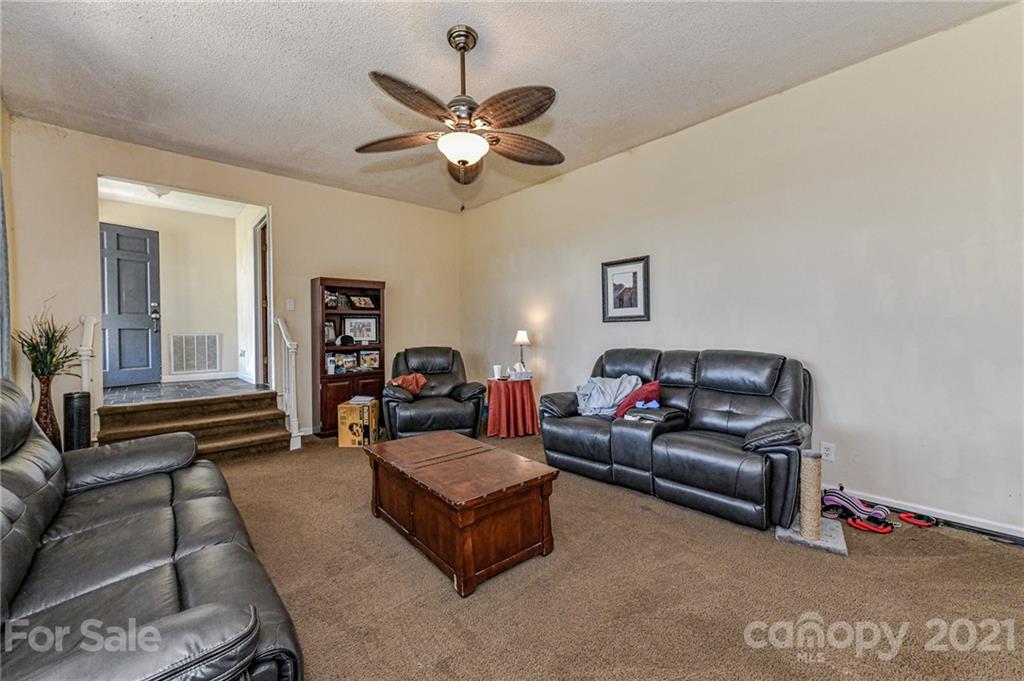 126 Baucom Deese Road Monroe, NC 28110 - Photo 8 of 28 a living room with furniture and a ceiling fan