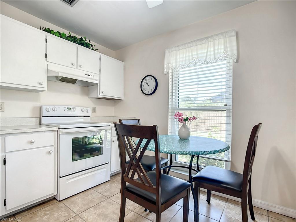 9072 Hamlin Road West Fort Myers, FL 33967 - Photo 14 of 50 a view of a dining room with furniture and a window