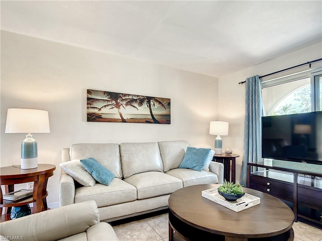 9072 Hamlin Road West Fort Myers, FL 33967 - Photo 2 of 50 a living room with furniture and a flat screen tv